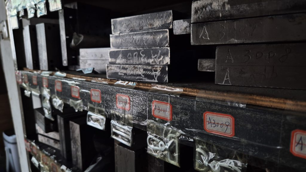 Hardware die casting molds on racks