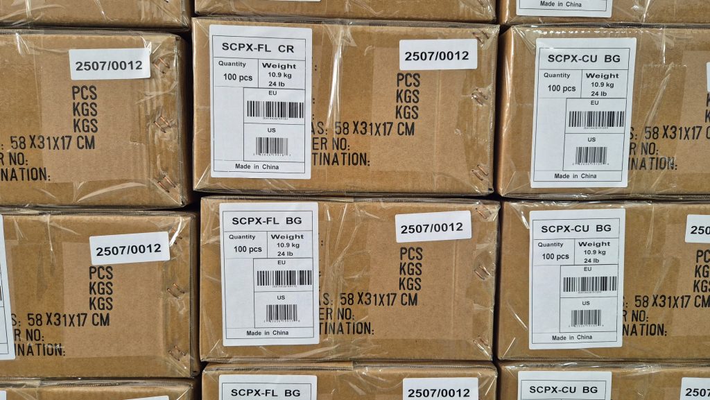 A pile of boxes with white stickers