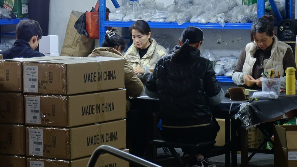 Workers are packing products for delivery