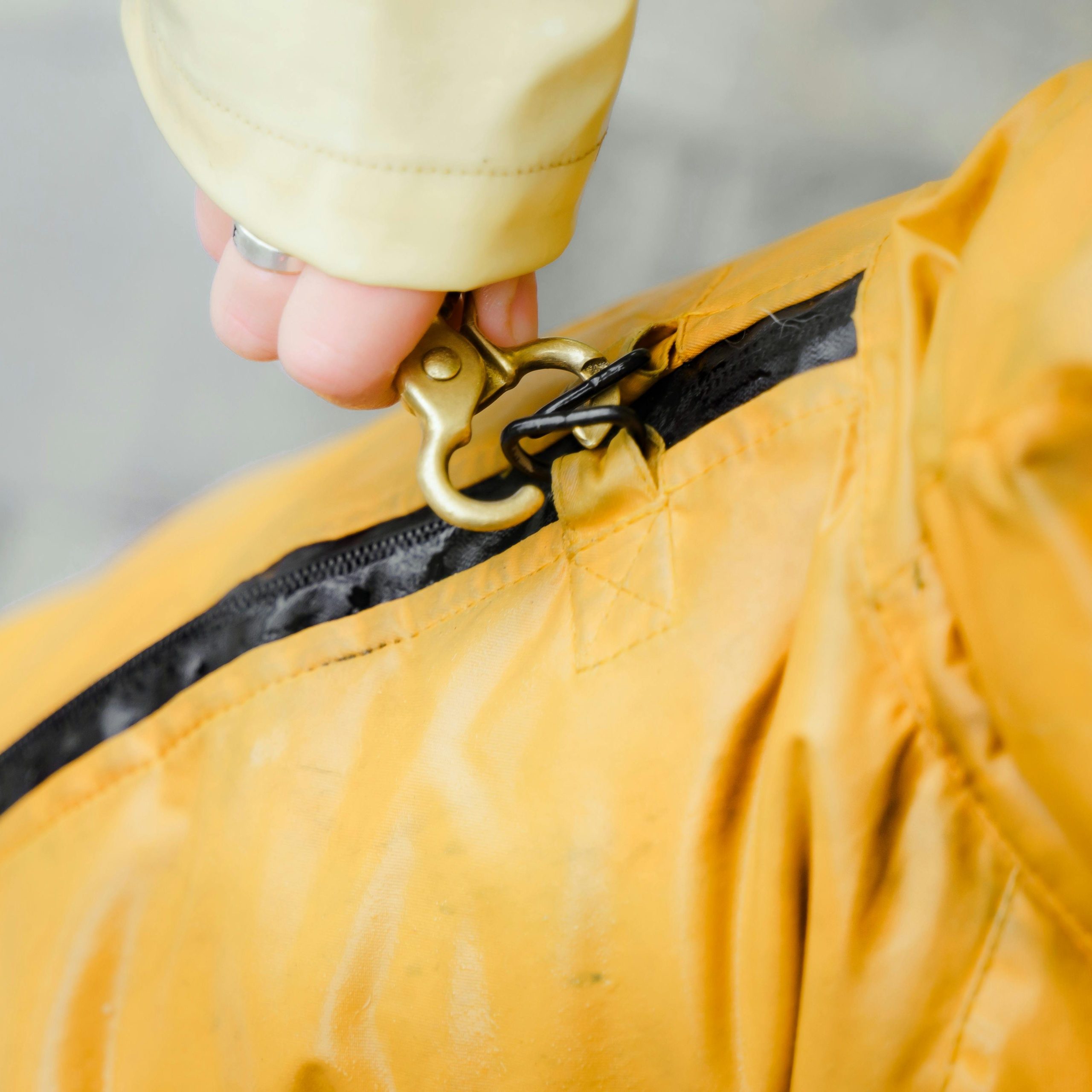 Cose-up view on the carabiner on a winter jacket