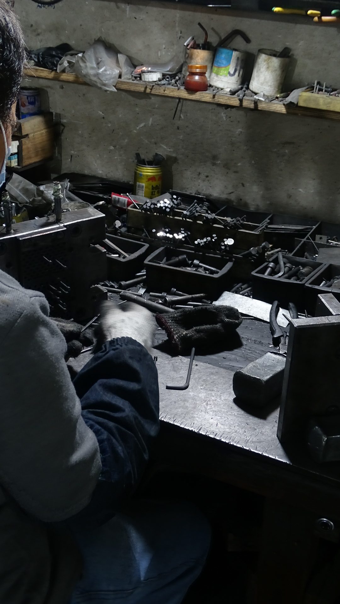 A man is fixing a mold for die casting